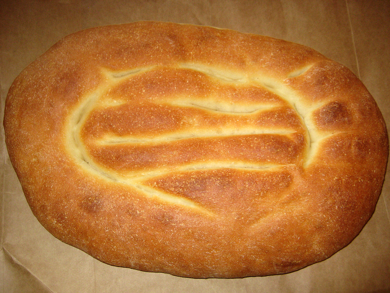 Oválný kvašený chléb v podobě placek zvaný matnakaš